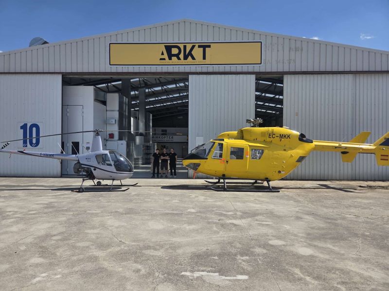 The Airkopter team and helicopters outside our hangar